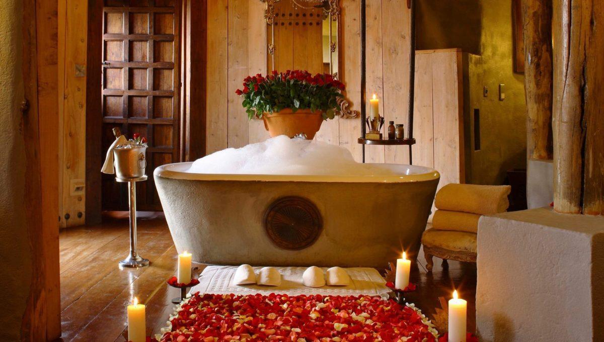 bathtub-filled-with-bubble-bath-and-rose-petals-at-andbeyond-ngorongoro-crater-lodge-on-a-luxury-safari-in-tanzania